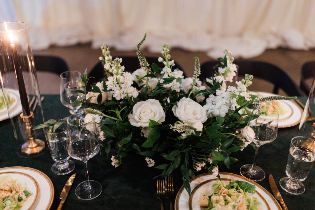 White and green flowers for a long wedding table.