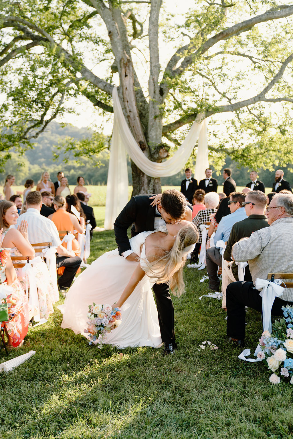 Bride and Groom Kiss Down Aisle at Southall Wedding Venue
